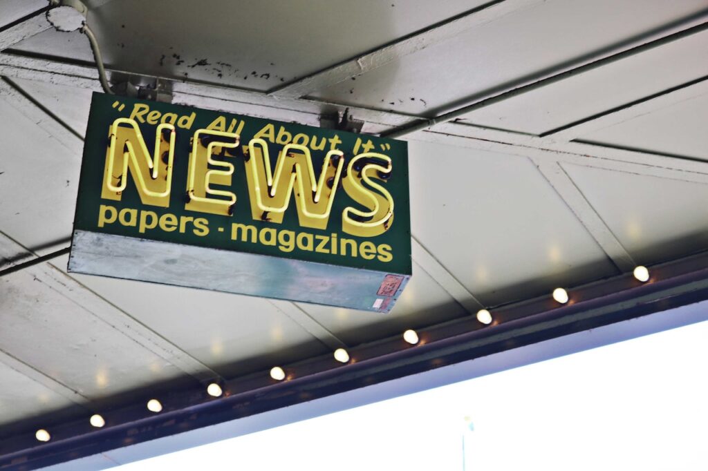 News inscription on neon sign in the street