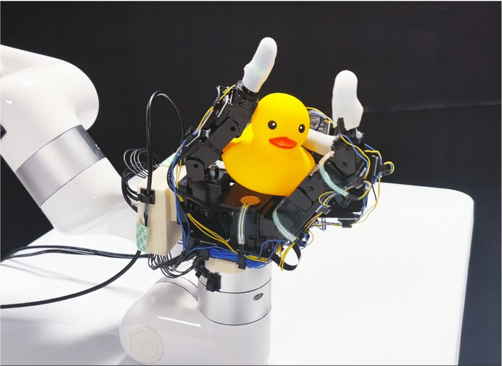 Robotic hand rotates objects using touch, not vision