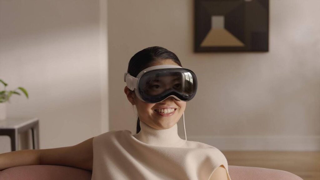 woman wearing Apple Vision Pro headset