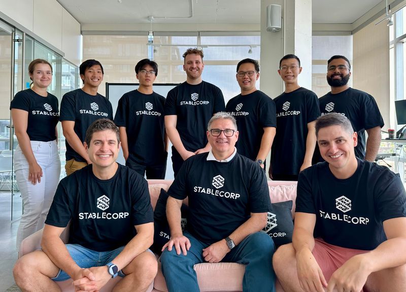 Stablecorp claims to have first regulator-approved stablecoin tied to Canadian dollar staff portrait in office with about a dozen people in navy stablecorp t shirts