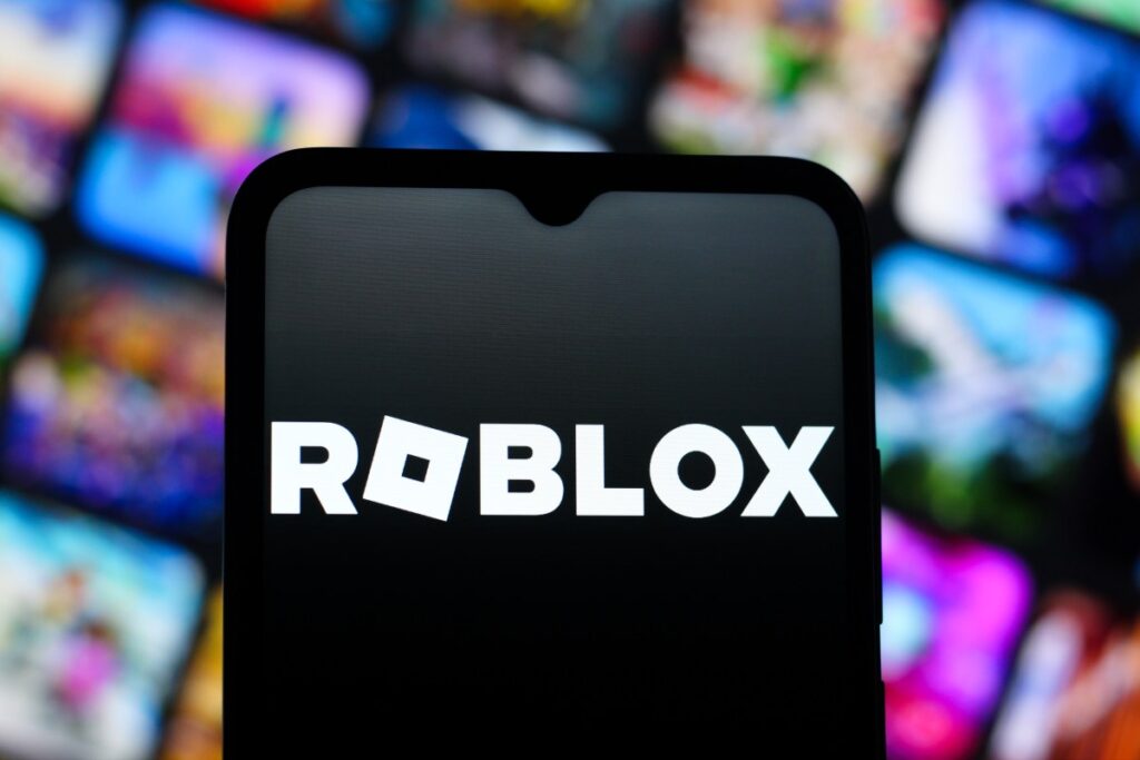 In this photo illustration, the Roblox Corporation logo is seen displayed on a smartphone screen.