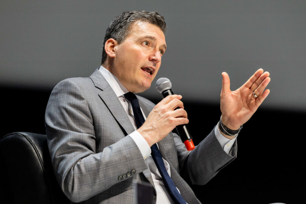 Have thoughts on AI transparency? The feds want your feedback Evan Solomon speaking into a microphone.