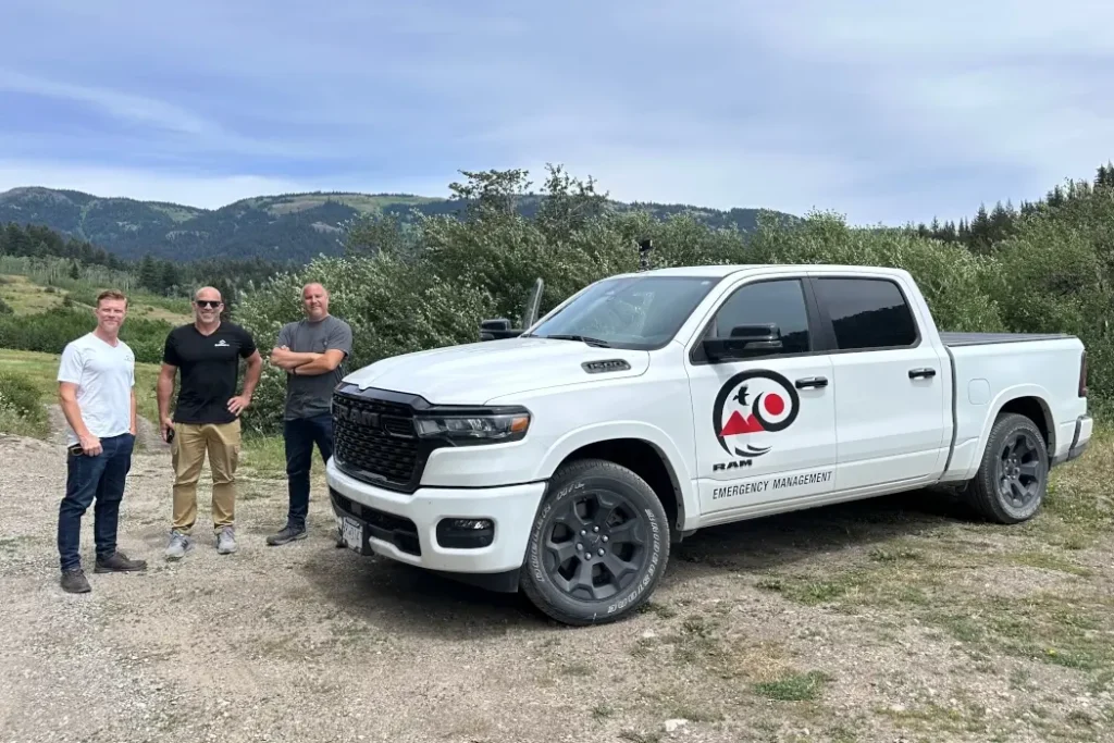 The Kelowna company helping map your way out of a wildfire BackRoadIntel team members stand beside a branded truck.