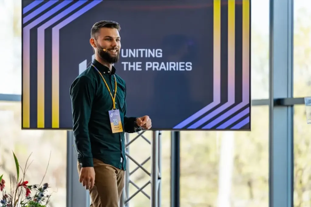 Jonathan Lipoth speaks on stage